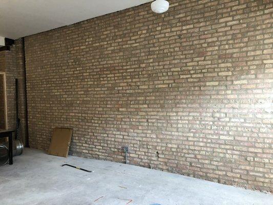 Finished exposed brick wall.