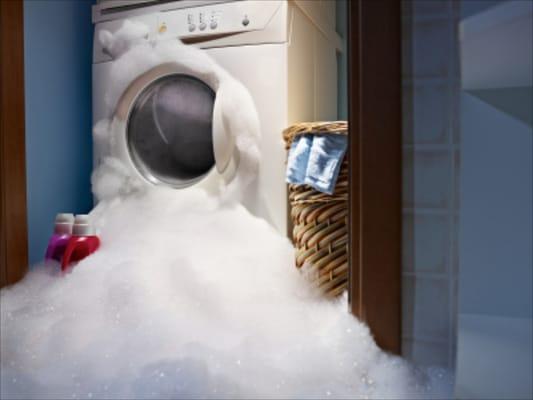 Leaking Washing Machine Causes Water Damage in Laundry Room