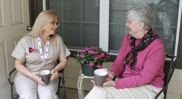 Caregiver spending quality time with Senior at home.