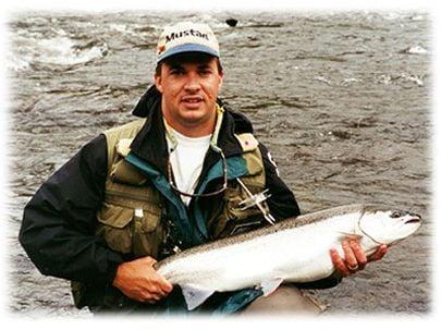 Jeff P. with a bright fresh steelhead taken on the Salmon River in Pulaski NY using a fly rod off the drift boat.