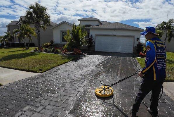 Paver driveway cleaning using a surface cleaner to remove all algae and dirt build up prior to paver sand, and seal.