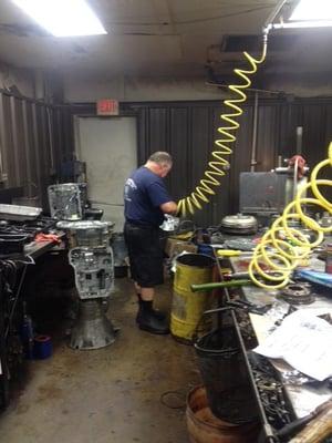 Darrell cleaning a transmission part before rebuild the transmission.