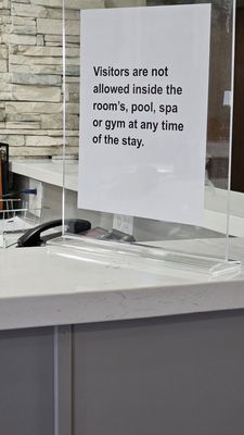 A sign stating you can't have guests