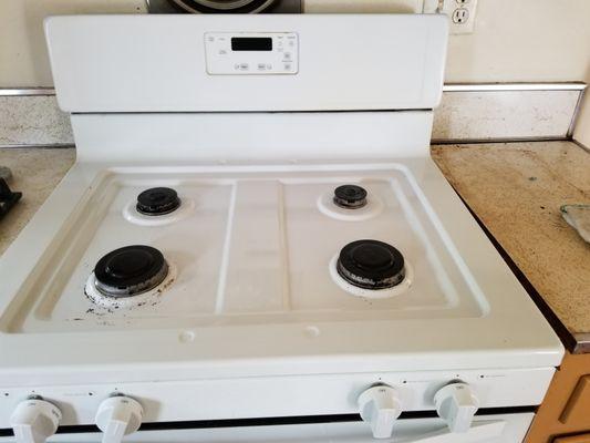 The same kitchen stove after it was professionally cleaned