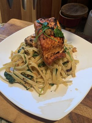 Seared Salmon; Fettuccine Pasta:Arugula;Lemon Butter Garlic Jalapeño Sauce