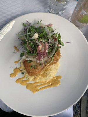 Fish with grits and coconut cream sauce.