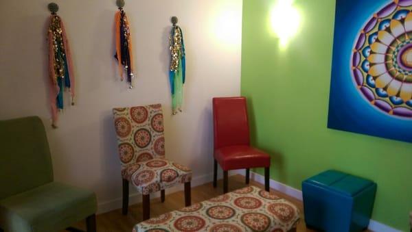 This is the waiting room. It has belly dancing scarves hanging from the wall and a wonderful manadala painting by Vikki Reed