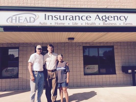 Previous owners Tom (Who still does our health insurance) and Alyce, with their grandson TJ (our youngest agent) in the middle.