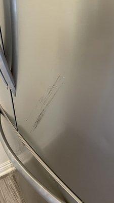 All the scratches that they made on our $2,500 fridge while bringing it up to the apartment!!!