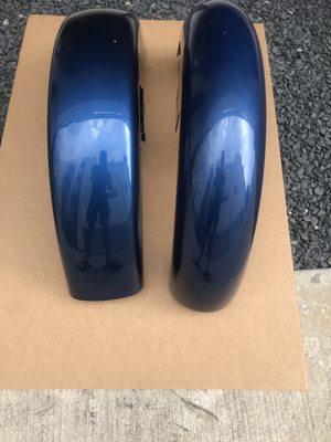 Harley original fender on left and perfectly matched after market fender on the right.