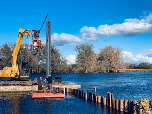 Driving sheet pilling for a launch ramp on the lower river at Port Barrington Marina