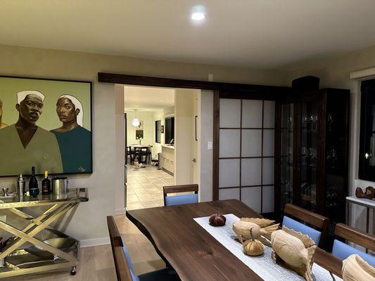 View of dining room to kitchen with an open Shoji door.