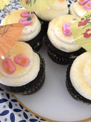 Frosting filled chocolate cupcakes beach summer decorated.