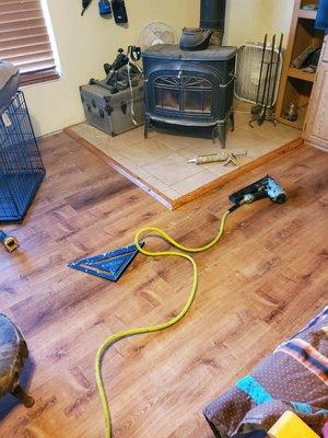 Installed vinyl planks & made the the transitions trim around fire place .