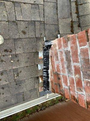 This is the counter flashing they installed on my chimney (the black strip).