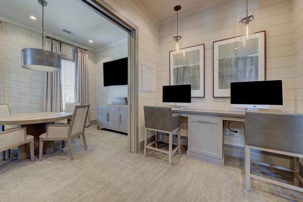 a dining room with a table and chairs and a tv