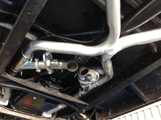 A custom exhaust on a Ford f-100. We are also a dealer for QTP cutouts!