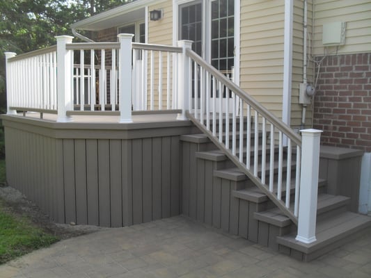 Composite Deck with two tone rails and solid enclosure. 
 Installed August 2014..