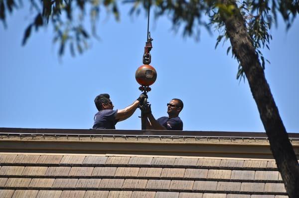 Eric and his helper on the roof at the club house.