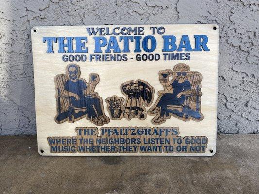 A custom-made wooden patio sign