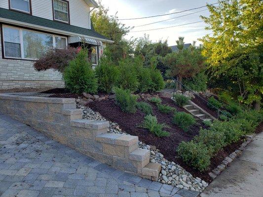 Complete overhaul complete with pavers, retaining walls and landscaping.