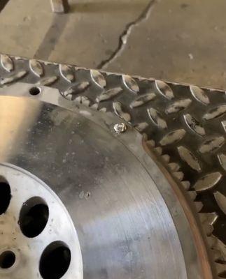 Flywheel with broken bolt