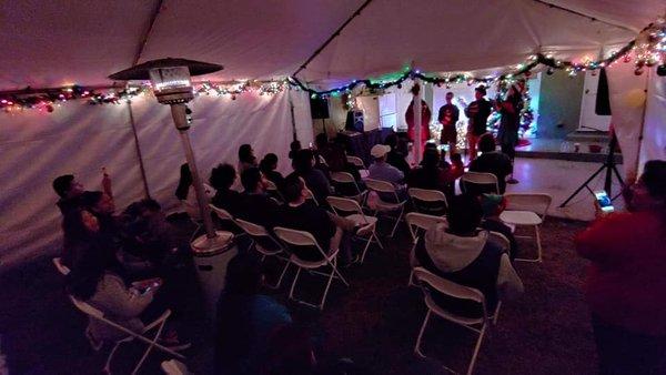 A predominantly Hispanic community in a home in Santa Ana enjoying our Spanish, English, and French Christmas repertoire.