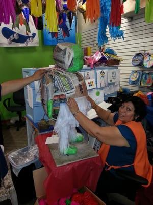 My beautiful mom customizing a piñata