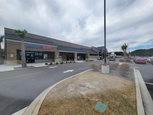 Shares a wall with regular Food Lion, but has a separate entrance. You have to exit liquor store to get inside grocery store next door.