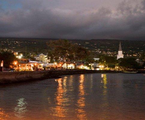 The town of Kailua-Kona Hawaii taken from the Kailua pier in the evening.