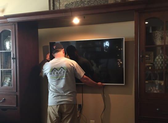 Andrew mounting a state of the art flat panel television