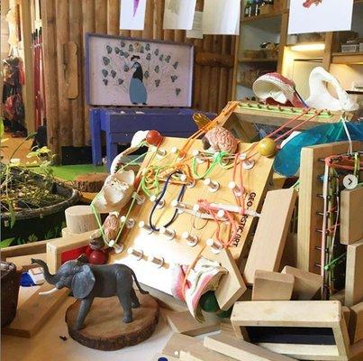 This was a house a couple of girls worked on for a long time...made with dominos, wood pieces, blocks, geo boards, rubber bands. and more.