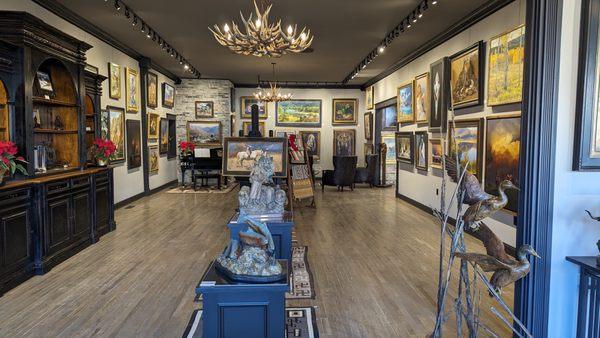 Left side of gallery with numerous sculptures, paintings and an area for quiet contemplation of the art!