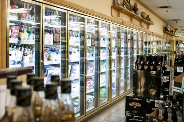 A long line of cooler doors to keep your beer and wine fresh.