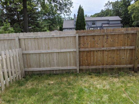 Before and after of this fence that has years of life left to come thanks to CV Paint & Stain and a professional water seal.