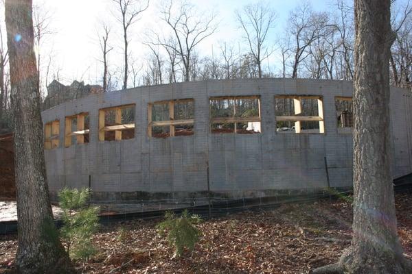 Poured concrete foundation wall.