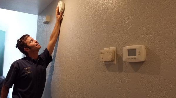 Smoke alarms are tested to be sure they are functional.