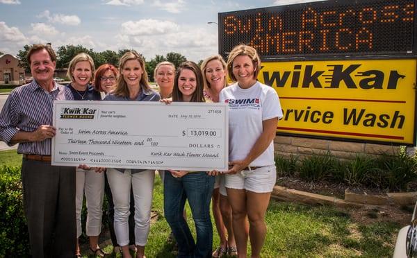 Kwik Kar Car Wash was able to present a check for over $13,000 to Swim Across America. We love supporting the community!