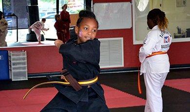 Color Belts practice Forms during a Summer Camp