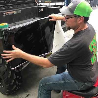 black vinyl wrap being applied