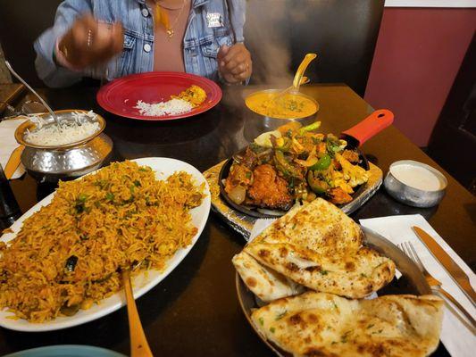 House Special Biryani, Tandoori Mixed Grill, Butter Chicken and Garlic Naan.