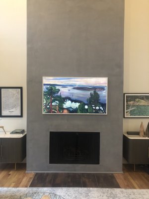 Samsung Frame Tv mounted above a fireplace in Leander Texas by Austin Tv Sales.