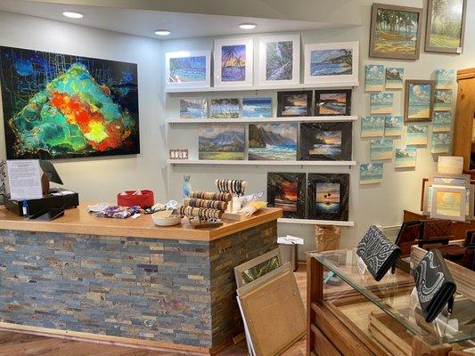 We carry wall art, great and small, as well as jewelry, glass works, pottery, leather goods, lights, stained glass, baskets, and more.