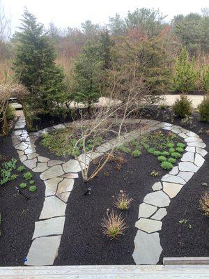 Irregular bluestone pathway through perennial garden 2023