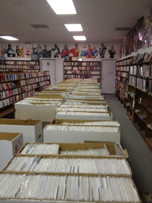 Comic section there are more boxes full under table