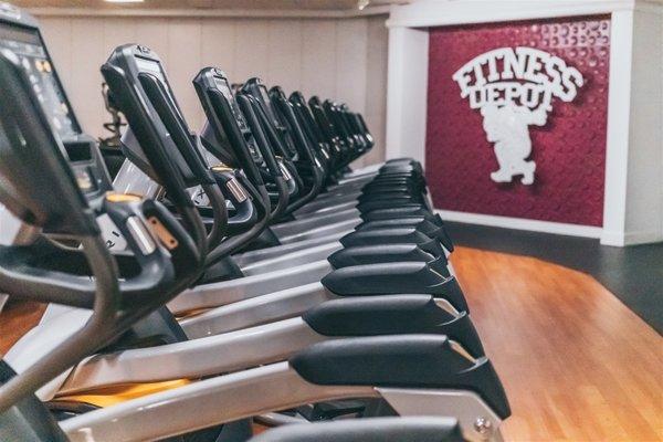 Large Cardio Area equipped with treadmills, ellipticals, stair mills and bikes.