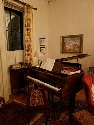 Do you know how to play this baby grand piano in the main parlor?