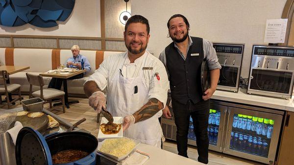 Executive Chef preparing his dishes with Steven, Server.