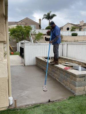 Alex working his magic on the concrete that was put down.