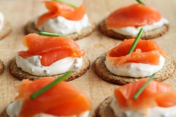 Smoked Salmon and Herbed Cream Cheese on Whole Wheat Crackers as Pass Hors D'oeuvres for a Wedding Reception